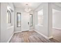 Bright foyer featuring a decorative light fixture, neutral walls, and a stylish rug at 422 E Kaibab Pl, Chandler, AZ 85249