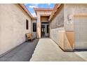 Inviting entrance with a bench, brick walkway, and secure front door at 776 W Carob Way, Chandler, AZ 85248