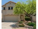 Two-story home featuring a two-car garage and a well-maintained front yard at 8259 W Carol Ave, Peoria, AZ 85345