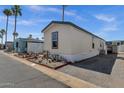 Well-kept manufactured home featuring beautiful desert landscaping and a clean, inviting exterior in a pleasant setting at 8421 E Main St # 116, Mesa, AZ 85207