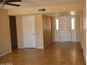 An entryway featuring tile floors and a glass-accented front door that welcomes visitors at 10326 W Harmont Dr, Peoria, AZ 85345