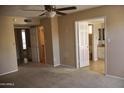 Main bedroom with adjoining bathroom and walk-in closet at 10326 W Harmont Dr, Peoria, AZ 85345