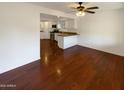 Bright living space with hardwood floors, neutral walls, and an open view to the kitchen at 1048 E 6Th Ave, Mesa, AZ 85204