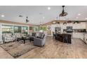 Bright open concept with an easy flow between the living room, dining area, and modern kitchen at 1087 Leisure World --, Mesa, AZ 85206