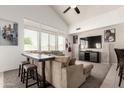 Spacious living room boasts high ceilings, ample natural light, and a comfortable seating area at 15811 N 155Th Dr, Surprise, AZ 85374