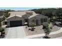 An impressive home featuring a tile roof, manicured landscaping, and private gated entrance at 4277 E Blue Sage Ct, Gilbert, AZ 85297