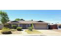 Charming single-story home featuring a well-maintained yard and attached two-car garage at 5539 E Dragoon Ave, Mesa, AZ 85206