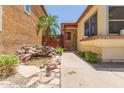 Close-up of the entrance featuring a water feature and a charming covered front porch at 6319 W Mercer Ln, Glendale, AZ 85304