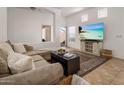 Bright living room with large sectional sofa and access to the backyard patio at 6610 E University Dr # 127, Mesa, AZ 85205
