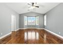 Spacious main bedroom with large windows and shutters allowing for an abundance of natural light at 6967 W Irma Ln, Glendale, AZ 85308