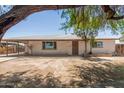 Charming single-story home with brick accents and a well-maintained front yard at 716 S Lewis --, Mesa, AZ 85210