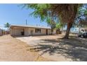 Single-story home featuring a carport and spacious driveway at 716 S Lewis --, Mesa, AZ 85210
