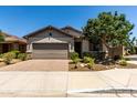 Charming single-story home with a well-manicured front yard and an attached two-car garage at 7423 S 28Th Pl, Phoenix, AZ 85042