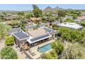 Aerial view of home with solar panels, outdoor kitchen, and private pool at 9421 E Calle De Valle Dr, Scottsdale, AZ 85255