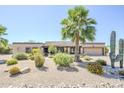 Charming home with mature landscaping, desert plants, and a well-kept yard at 9421 E Calle De Valle Dr, Scottsdale, AZ 85255