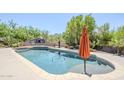 Beautiful backyard pool with an outdoor kitchen area at 9421 E Calle De Valle Dr, Scottsdale, AZ 85255