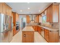 Spacious kitchen features stainless steel appliances, granite countertops, and custom cabinetry at 20809 N 17Th St, Phoenix, AZ 85024