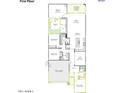 First floor plan showcasing a primary suite, two-car garage, open kitchen and dining areas at 2179 E Mill Rd, San Tan Valley, AZ 85140