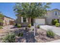 Single-story home featuring desert landscaping, an attached two-car garage, and inviting curb appeal at 297 W Nikita Dr, San Tan Valley, AZ 85140