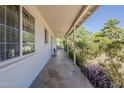 Inviting covered porch with view of greenery and natural light at 3347 W Roma Ave, Phoenix, AZ 85017