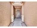Welcoming entryway featuring a covered porch and a stylish front door at 4455 W Suncup Dr, San Tan Valley, AZ 85144