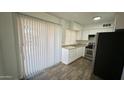 Efficient kitchen with stainless steel appliances and laminate wood flooring at 4625 W Thomas Rd # 48, Phoenix, AZ 85031