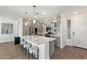 Bright kitchen with stainless steel appliances, white countertops, and modern pendant lighting at 5100 E Rancho Paloma Dr # 1044, Cave Creek, AZ 85331
