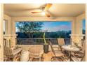 Relaxing patio with mountain views, comfortable seating, and a ceiling fan at 5100 E Rancho Paloma Dr # 1044, Cave Creek, AZ 85331