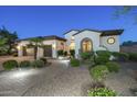 Charming single-Gathering home with lush front yard, mature trees and convenient two-car garage at 5243 E Windstone Trl, Cave Creek, AZ 85331