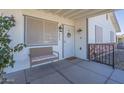 Cozy front porch with seating and decorative details welcomes you home at 643 N 92Nd Pl, Mesa, AZ 85207
