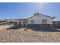 Well-maintained single-story home with desert landscaping and a covered front entry at 643 N 92Nd Pl, Mesa, AZ 85207