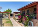 Exterior shot of property, displaying landscaping, walkways and covered parking, for a convenient lifestyle at 6739 N 16Th St # 14, Phoenix, AZ 85016