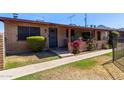 Inviting home with a cozy front porch and colorful landscaping, providing a warm and welcoming ambiance at 6739 N 16Th St # 14, Phoenix, AZ 85016