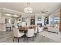 Inviting open-concept living space with a fireplace, breakfast bar, and elegant dining area, perfect for entertaining at 7601 E Indian Bend Rd # 3002, Scottsdale, AZ 85250
