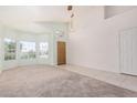 Bright living room featuring neutral carpet, tile flooring, a bay window and lots of natural light at 786 S Catalina St, Gilbert, AZ 85233