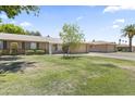 Attractive single-level home boasts a manicured front yard and an attached garage for easy access at 9434 W Greenway Rd, Sun City, AZ 85351