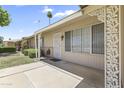 Welcoming front entrance with a security door and decorative accents, perfect for a cozy home at 9434 W Greenway Rd, Sun City, AZ 85351