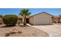 Charming single-story home featuring a two-car garage, desert landscaping, and a well-maintained yard at 9825 N 44Th Ave, Glendale, AZ 85302