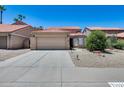 Charming single-story home with a well-maintained yard, two-car garage, and inviting curb appeal at 11217 E Laurel Ln, Scottsdale, AZ 85259