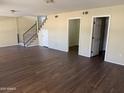 Open-concept living room featuring new, modern flooring and an abundance of natural light at 1212 W Glenmere Dr, Chandler, AZ 85224