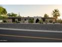 Well-maintained home featuring desert landscaping and a modern architectural design at 13034 N 8Th Ave, Phoenix, AZ 85029