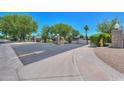 Community gate with lush landscaping and a well-maintained entrance perfect for privacy at 1417 E Marshall Ave, Phoenix, AZ 85014