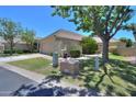 A single-story home with a tile roof, large yard, and a charming entrance with privacy at 1417 E Marshall Ave, Phoenix, AZ 85014