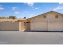 Two-car garage with adjacent entry gate, offering convenience and privacy at 18416 N Spanish Garden Dr, Sun City West, AZ 85375