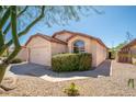 Charming home with a well-maintained front yard, desert landscaping and a two-car garage at 21632 N 48Th St, Phoenix, AZ 85054