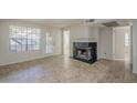 Spacious living room featuring tile floors, fireplace and large windows for natural light at 2333 E Southern Ave # 1023, Tempe, AZ 85282