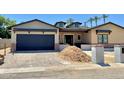 Beautifully crafted single-Gathering home featuring a modern garage door and a unique exterior design on a sunny day at 3028 N 47Th St, Phoenix, AZ 85018