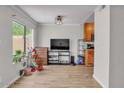 Living room with a large window and view and wood-look vinyl flooring at 3500 N Hayden Rd # 203, Scottsdale, AZ 85251