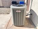 Lennox brand central air conditioning unit on a paved surface at 3810 N 106Th Dr, Avondale, AZ 85392