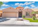 Charming single-story home featuring a well-manicured lawn, desert landscaping, and a two-car garage in a desirable location at 5123 W Redbird Rd, Phoenix, AZ 85083